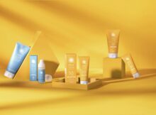 Speick Sun Produkte auf ockerfarbenem Hintergrund